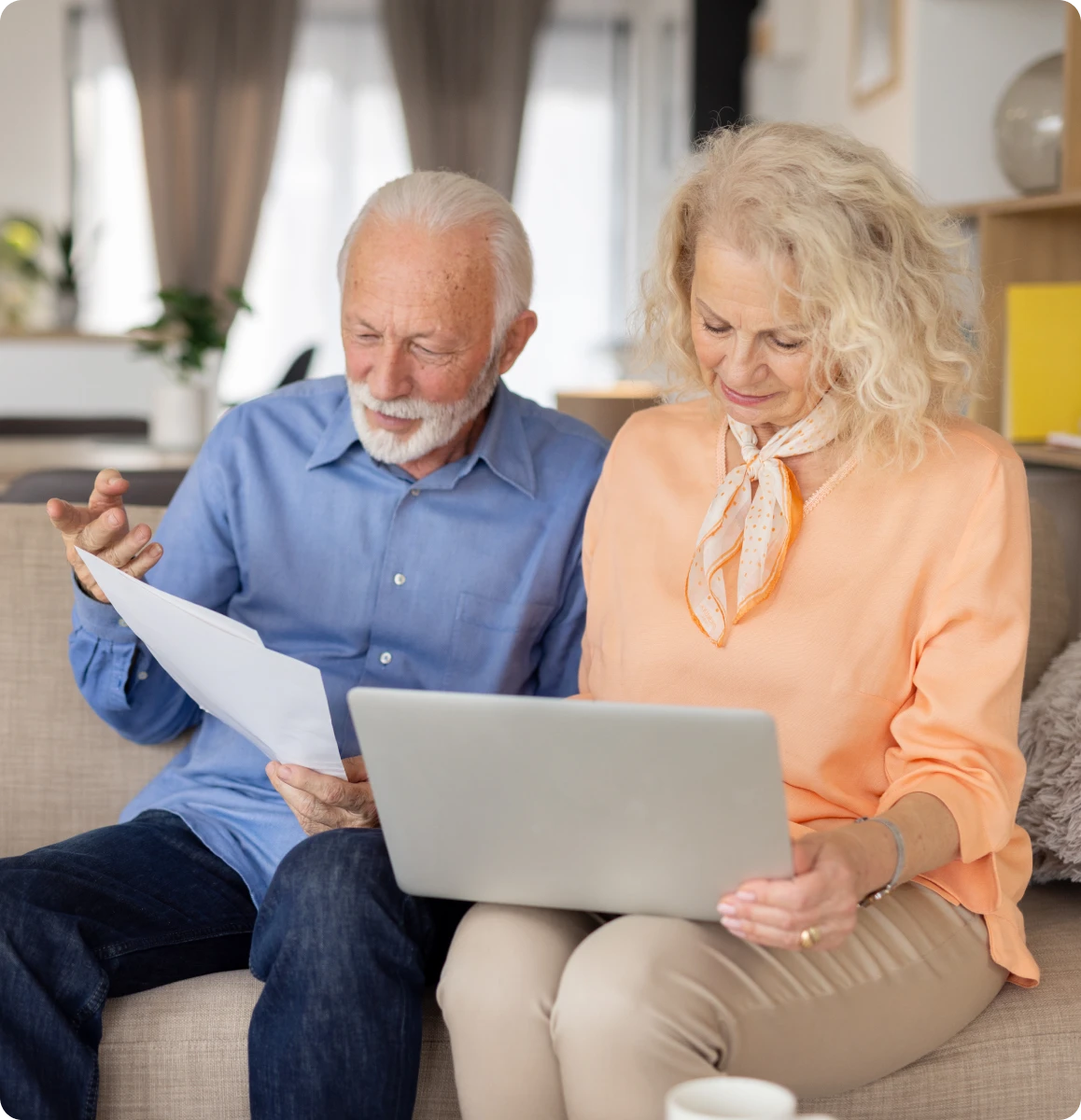 Elderly couple reviewing documents together